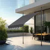 An outdoor patio with a dining set and a retractable awning. Náhled obrázku produktu