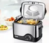 A stainless steel and black deep fryer with a basket full of fried food is shown in a kitchen setting, with bowls of food in the background. Produktbild-Vorschau