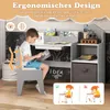 A child is sitting at a desk, reading a book. The desk has shelves and a drawer. The image highlights the ergonomic design of the chair. Podgląd zdjęcia produktu