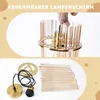 A collage showing a hand assembling a lamp and the disassembled parts of a pendant lamp. Anteprima dell’immagine prodotto