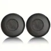 Two black ear pads for headphones are shown against a white background. Produktbild-Vorschau