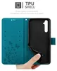 An open teal flip phone case showing the inside with card slots and a black TPU shell for a phone. Náhled obrázku produktu