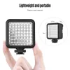 A hand holding a small square LED light with a diagram showing its dimensions. Náhled obrázku produktu