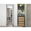 An entryway with a shoe cabinet, key holder, and a doorway leading to another room. Podgląd zdjęcia produktu