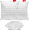 Three white pillows with a quilted pattern are displayed against a white background. Two pillows are stacked behind a third pillow, which is positioned in the foreground. Produktbild-Vorschau