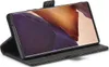A smartphone in a black leather wallet case, standing upright. Produktbild-Vorschau