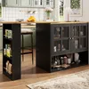 A modern kitchen island with a black cabinet and glass doors, featuring a wooden countertop and shelves stocked with various items. A stool is pulled up to the island, suggesting a functional dining or preparation space. Produktbild-Vorschau