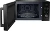 An open black microwave oven with its interior visible, showing the turntable and control panel. Anteprima dell’immagine prodotto