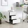A modern office setting with a white filing cabinet and a desk. Náhled obrázku produktu
