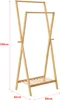 A wooden garment rack with two hanging rails and a bottom shelf, shown against a white background with dimensions indicated. Náhled obrázku produktu