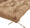 A close-up view of a tufted cushion with ties. Náhled obrázku produktu