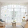 A living room scene with sheer curtains featuring a polka dot pattern. Produktbild-Vorschau