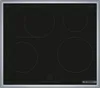 A top-down view of a black induction cooktop with four heating zones and control panel. Voir les images du produit