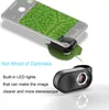 A smartphone is shown with a clip-on microscope attached, magnifying a leaf. Another microscope is shown separately. Produktbild-Vorschau