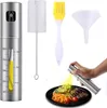 A set of kitchen tools including an oil sprayer, cleaning brush, basting brush, and funnel, with a person spraying oil onto food. Produktbild-Vorschau
