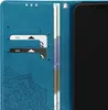 A close-up view of a blue phone case with card slots and a phone. Podgląd zdjęcia produktu