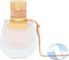 A perfume bottle with a gold cap and a pink ribbon. Anteprima dell’immagine prodotto