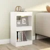 A white bookshelf placed next to a sofa in a room. Produktbild-Vorschau