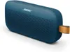 A blue Bose SoundLink Flex portable Bluetooth speaker with a brown strap is shown against a white background. Produktbild-Vorschau