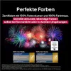 Marketing image for LG OLED TV featuring fireworks and text highlighting color fidelity and volume. Produktbild-Vorschau