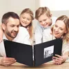 A family looking at a photo album. Produktbild-Vorschau