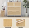 A white and natural wood kommode with rattan drawer fronts is shown in a room setting, with a plant and umbrellas nearby. Below are close-up images of the rattan texture and a wooden handle. Podgląd zdjęcia produktu