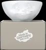 A white ceramic bowl with a face design sits on top of its packaging box. Anteprima dell’immagine prodotto