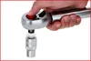 A hand is holding a torque wrench and attaching a socket. Podgląd zdjęcia produktu