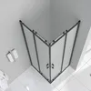 A corner shower cabin with frosted glass doors and black frames, shown from a top-down angle in a bathroom setting. A towel and a brush are visible on the wall. Produktbild-Vorschau