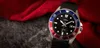 A close-up shot of a Casio watch with a red and blue bezel, set against a dark textured surface and a draped red fabric. Produktbild-Vorschau