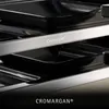 A close-up view of a WMF Lono Selection Raclettegrill, showing the metal frame and the black grill pans. Náhľad obrázku produktu