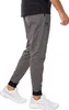 A person wearing Under Armour joggers and sneakers, shown from the waist down. Produktbild-Vorschau