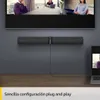 A Jabra PanaCast 50 video conferencing bar is mounted below a large screen displaying a virtual meeting. A laptop is also visible on the desk. Anteprima dell’immagine prodotto