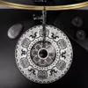 A close-up overhead view of a decorative basin on a black countertop. Náhled obrázku produktu