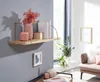 A wooden shelf with decorative items is mounted on a gray wall, with a window and furniture in the background. Podgląd zdjęcia produktu