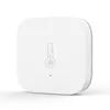 A white square smart home sensor with a thermometer icon and a small indicator light. Voir les images du produit