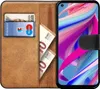 A brown leather wallet case for a smartphone, with a credit card and euro banknotes inserted. Produktbild-Vorschau
