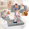 Children playing with a modular foam sofa set and ball pit in a nursery or playroom. Voir les images du produit