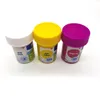 Three small paint pots with colorful lids and labels, arranged diagonally on a white background. Produktbild-Vorschau