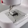 Close-up view of the needle and presser foot area of a sewing machine. Produktbild-Vorschau
