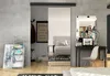 A modern bedroom with a sliding mirror door, a desk with a laptop, and decorative items. Náhľad obrázku produktu