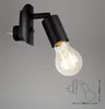 A black plug-in spotlight with a visible light bulb and a diagram showing its dimensions. Produktbild-Vorschau