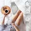 A person lying in bed with a hot water bottle, coffee, and pastries. Anteprima dell’immagine prodotto