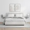 A bedroom scene with a bed and two wall shelves. Produktbild-Vorschau