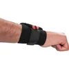 A close-up side view of a person's forearm and wrist wearing a black wrist brace with orange accents. Náhľad obrázku produktu