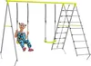 A young girl is sitting on a swing in a playground set. Produktbild-Vorschau