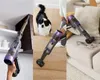 A collage of three images showing a cordless stick vacuum cleaner being used in different settings: cleaning a high corner, cleaning stairs with a dog nearby, and cleaning a sofa. Anteprima dell’immagine prodotto
