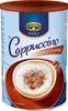 A can of Krüger Cappuccino with a cup of cappuccino in the foreground. Podgląd zdjęcia produktu
