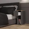 A bedside table next to a bed. Náhled obrázku produktu