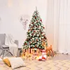 A decorated Christmas tree with presents underneath, in a cozy room setting. Produktbild-Vorschau